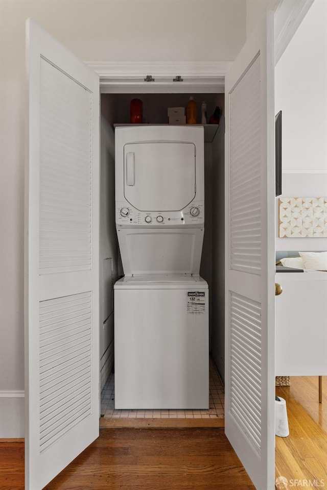 3294 Clay St Unit 6, San Francisco, CA 94123 - laundry room featuring stacked washing machine and dryer and wood finished floors