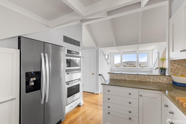3294 Clay St Unit 6, San Francisco, CA 94123 - kitchen with stainless steel appliances, white cabinets, tasteful backsplash, light wood-type flooring, and a peninsula