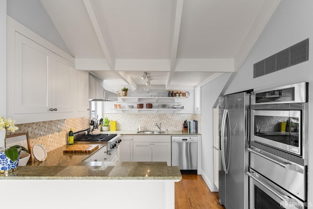 3294 Clay St Unit 6, San Francisco, CA 94123 - kitchen featuring appliances with stainless steel finishes, light wood-style flooring, open shelves, light stone counters, and backsplash