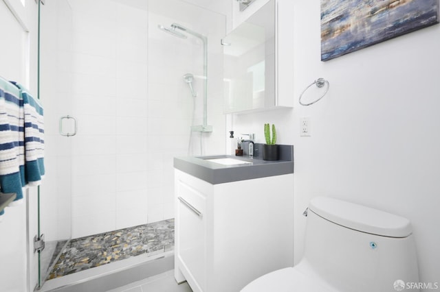 full bathroom with a shower stall, toilet, and vanity