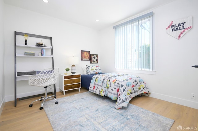 bedroom featuring recessed lighting, baseboards, and wood finished floors