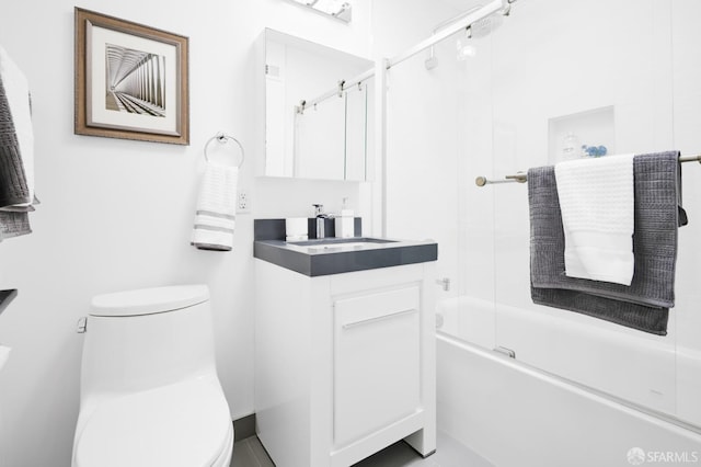 full bathroom featuring toilet, vanity, and bath / shower combo with glass door