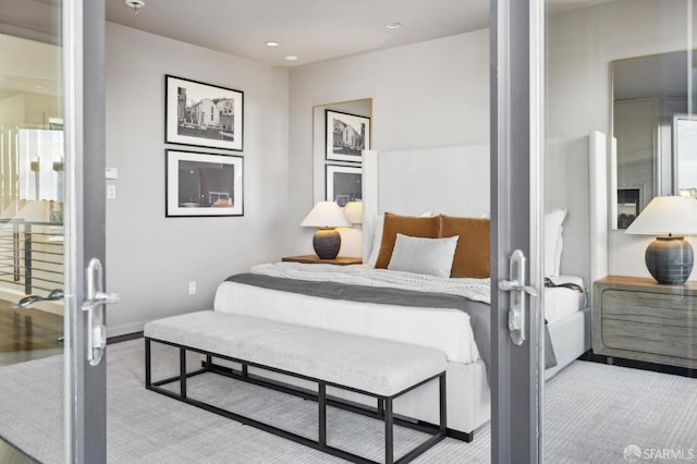 bedroom with recessed lighting, french doors, and baseboards