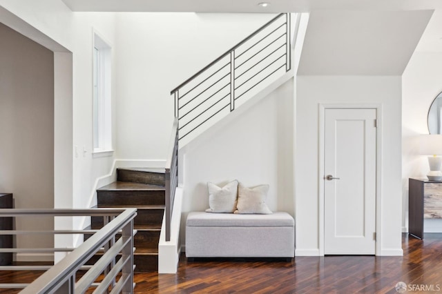 stairway with wood finished floors