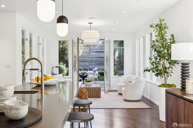 sitting room featuring recessed lighting, baseboards, and wood finished floors