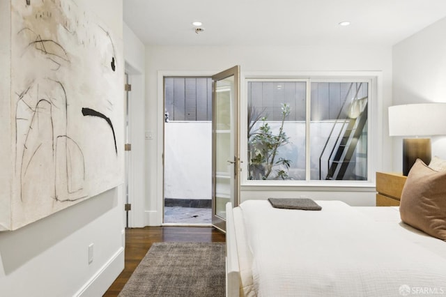 bedroom with recessed lighting and wood finished floors