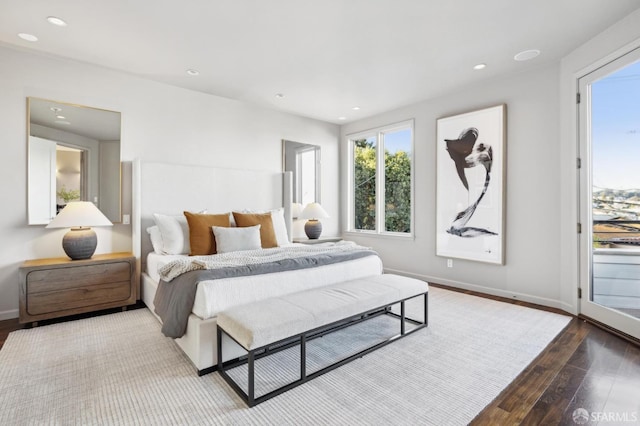 bedroom with recessed lighting, baseboards, and wood finished floors