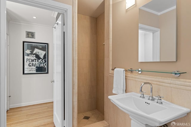 126 Scott St, San Francisco, CA 94117 - full bathroom featuring a sink, ornamental molding, a tile shower, and wood finished floors