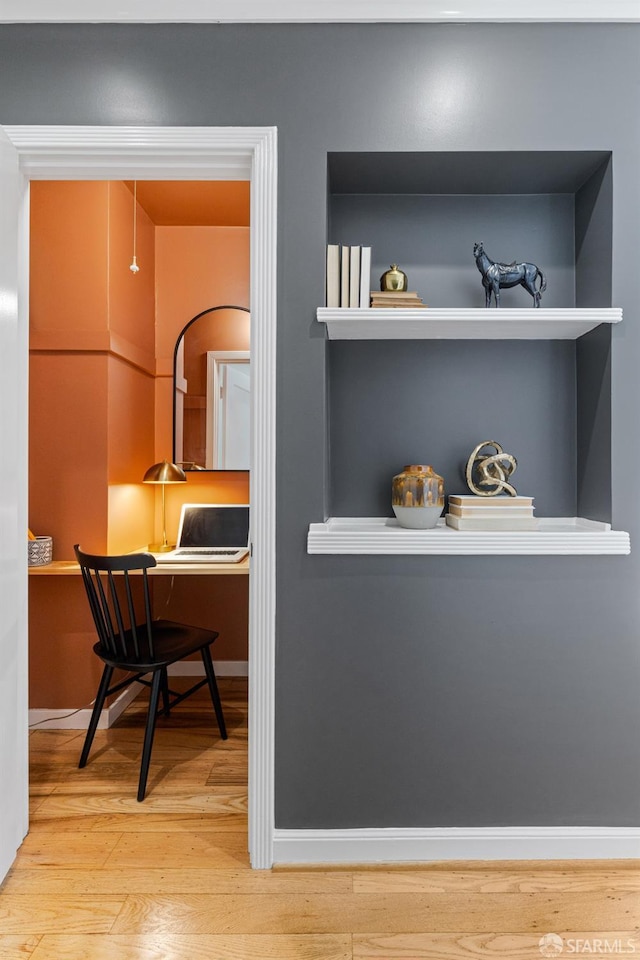 126 Scott St, San Francisco, CA 94117 - detailed view of wood finished floors, a desk, and baseboards