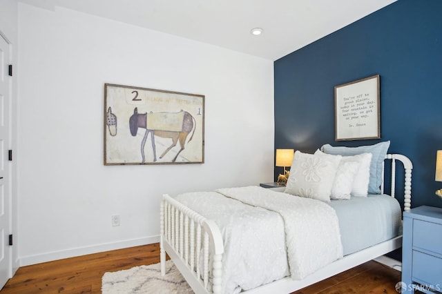 bedroom featuring recessed lighting, baseboards, and wood finished floors