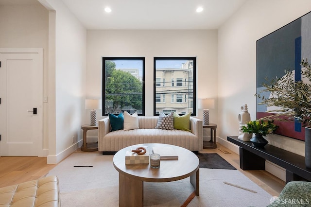 interior space featuring recessed lighting, baseboards, and wood finished floors