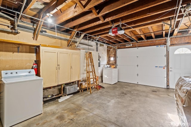 garage with washer / clothes dryer and a garage door opener