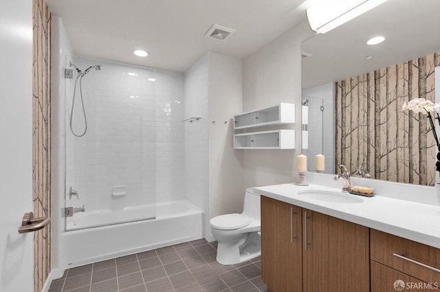 full bathroom with toilet, tiled shower / bath combo, and vanity