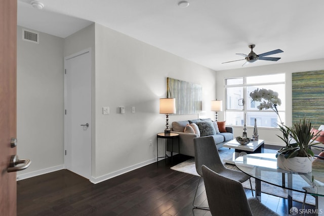 dining space with dark hardwood / wood-style floors and ceiling fan