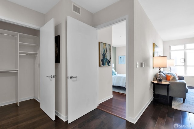 hallway with dark wood-type flooring