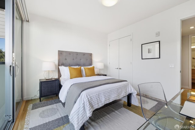 bedroom featuring a closet and wood finished floors