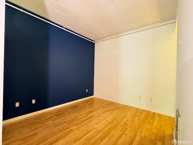 empty room featuring hardwood / wood-style flooring