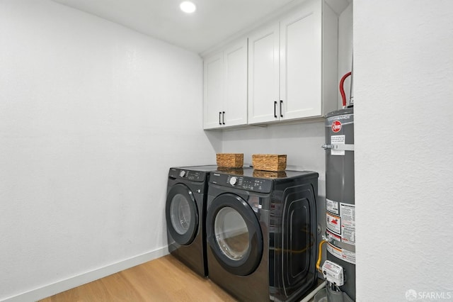 3901 La Colina Rd, El Sobrante, CA 94803 - laundry area featuring washer and dryer, water heater, light wood finished floors, cabinet space, and baseboards