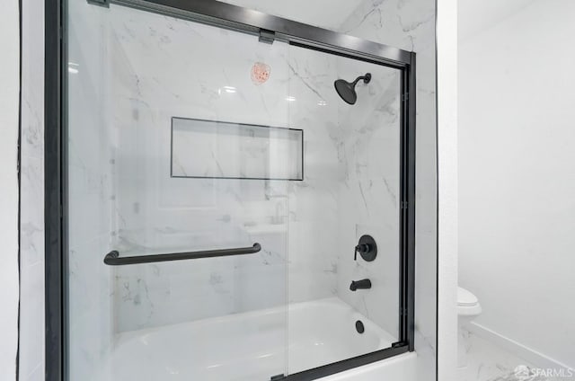 3901 La Colina Rd, El Sobrante, CA 94803 - full bathroom with toilet, combined bath / shower with glass door, marble look tiles, and baseboards