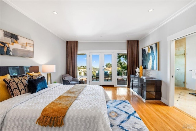 bedroom featuring access to exterior, french doors, crown molding, light wood-style flooring, and baseboards