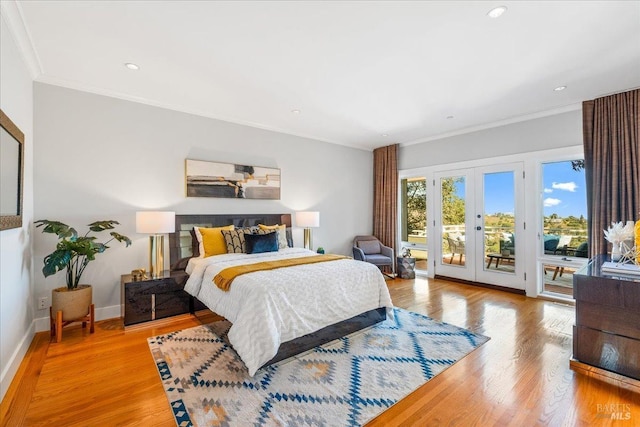 bedroom with wood finished floors, baseboards, access to exterior, french doors, and crown molding