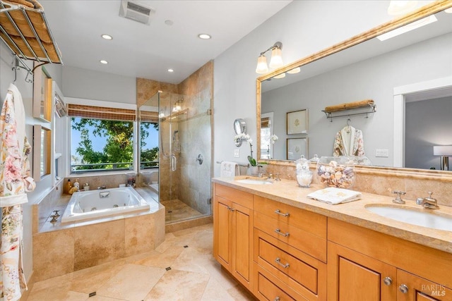 bathroom with a whirlpool tub, double vanity, a sink, and a shower stall