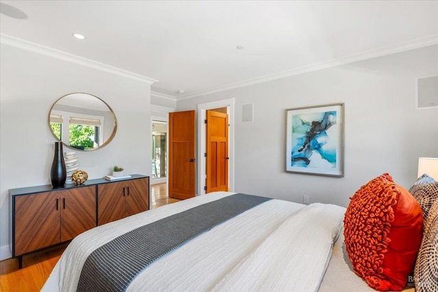 bedroom with recessed lighting, light wood-type flooring, and crown molding