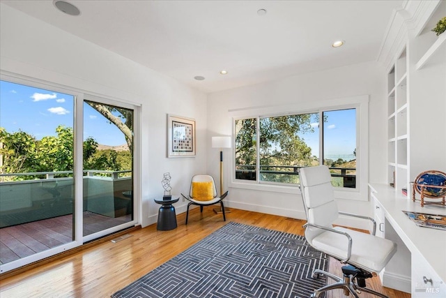 home office with recessed lighting, visible vents, baseboards, and wood finished floors