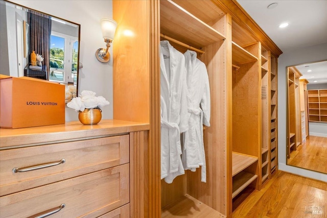 spacious closet with wood finished floors