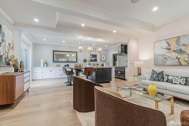 living room featuring crown molding, recessed lighting, and light wood-style floors