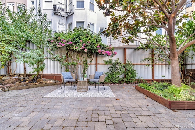 view of patio featuring fence