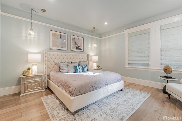 bedroom featuring baseboards, recessed lighting, and light wood-style flooring