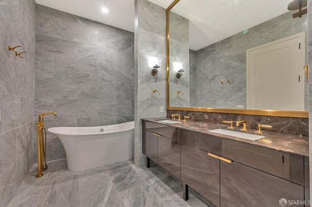 288 Pacific Ave Unit 4E, San Francisco, CA 94111 - full bathroom with tile walls, marble tiled flooring, a soaking tub, and double vanity