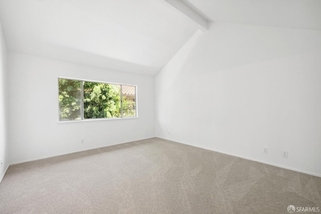 empty room featuring baseboards, lofted ceiling with beams, and carpet flooring