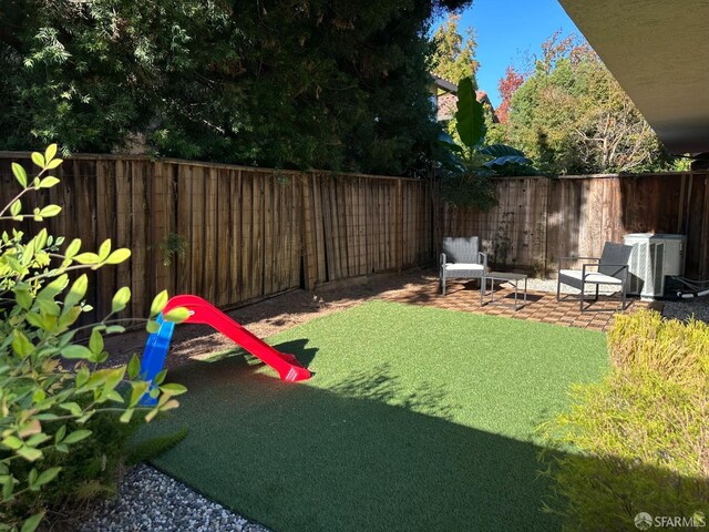view of yard with a patio and a fenced backyard