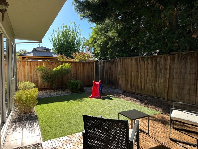 view of yard featuring a patio and a fenced backyard