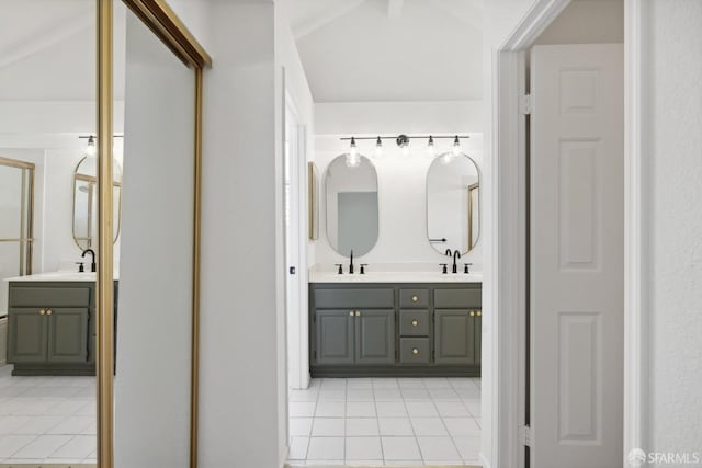 bathroom featuring double vanity, tile patterned flooring, and a sink