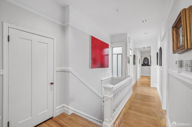 hallway with light hardwood / wood-style flooring