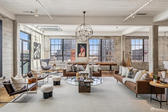 6 Mint Plz Unit 900A, San Francisco, CA 94103 - living area featuring a chandelier, healthy amount of natural light, wood finished floors, and beamed ceiling
