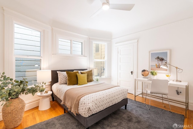 350 Dolores St, San Francisco, CA 94110 - bedroom with ornamental molding, a ceiling fan, and wood finished floors
