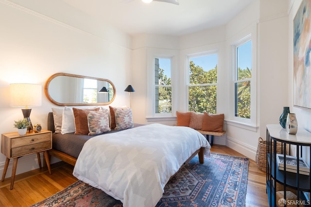 350 Dolores St, San Francisco, CA 94110 - bedroom with baseboards, wood finished floors, and multiple windows