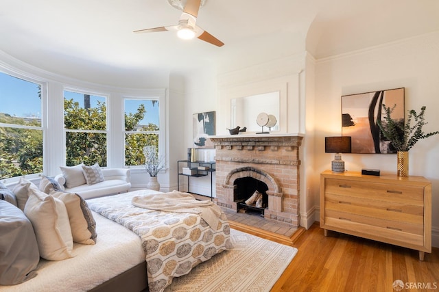 350 Dolores St, San Francisco, CA 94110 - bedroom with ceiling fan, a brick fireplace, and wood finished floors