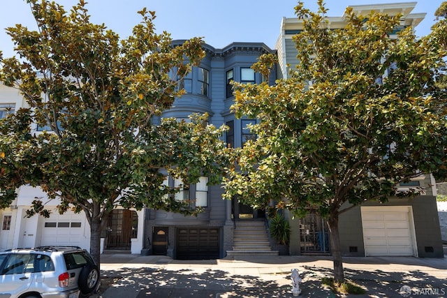350 Dolores St, San Francisco, CA 94110 - view of front facade featuring a garage