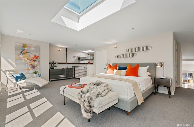 bedroom featuring carpet flooring and a skylight