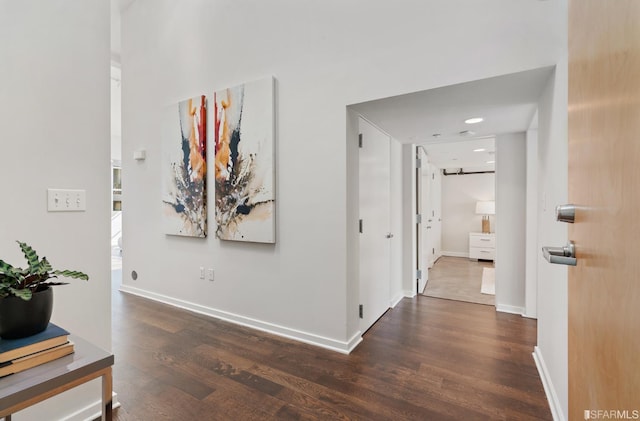 hall with dark wood-type flooring