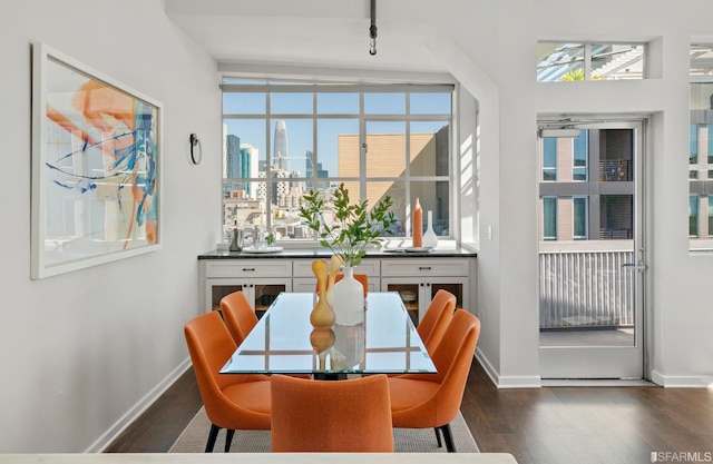 dining area with dark hardwood / wood-style flooring