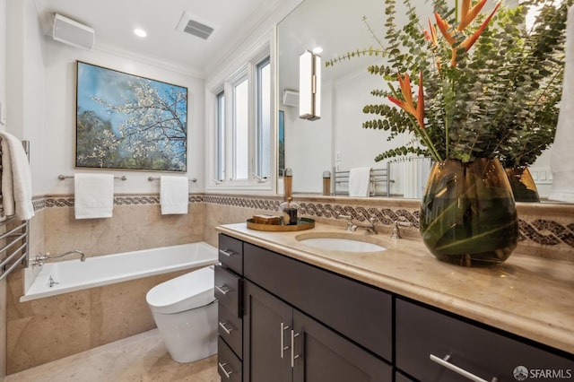 full bath with visible vents, toilet, ornamental molding, a garden tub, and vanity