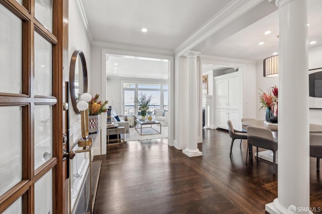 entrance foyer with dark wood-style flooring, recessed lighting, decorative columns, and crown molding