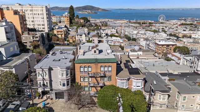 drone / aerial view featuring a water and mountain view