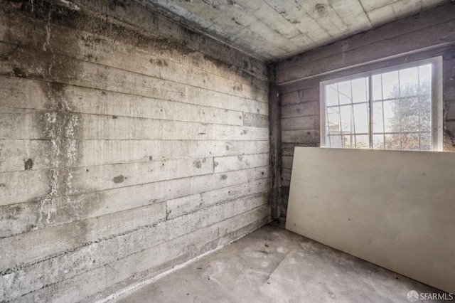 empty room featuring unfinished concrete flooring